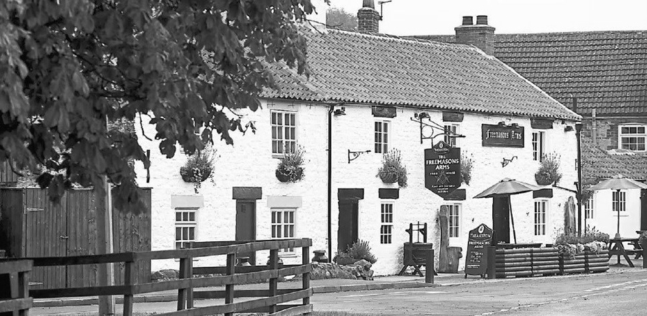 A historic photograph of The Freemasons Arms